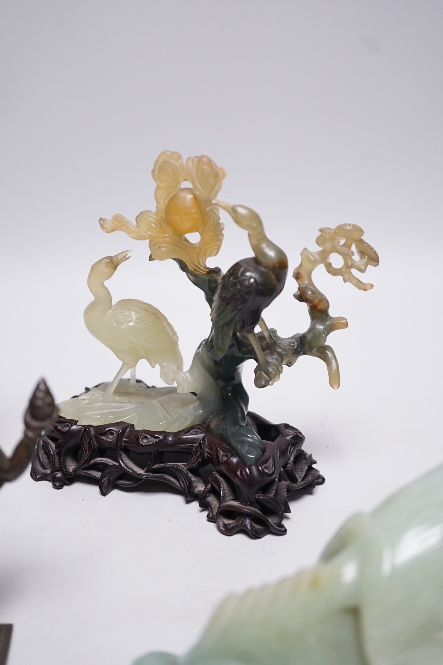 A Chinese bowenite jade bird group, together with a Jadeite figure of lady, 19.5cm high, a bowenite model of a goldfish, and an Indian brass figure